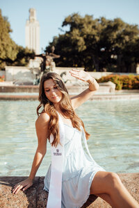 Graduating senior poses for senior picture