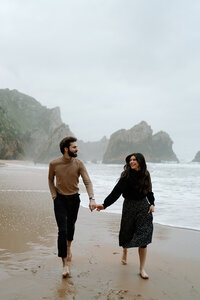 Destination Elopement Photographer captures couple walking on the beach during couples portraits