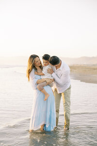 Candid moment of parents and their kid during outdoor session | Fresno photographer Ashley Norton