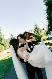 Bride and groom popping champagne at their wedding