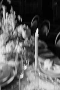 blurry black and white photo of wedding reception table