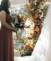 Fall themed wedding with golden and rose florals.