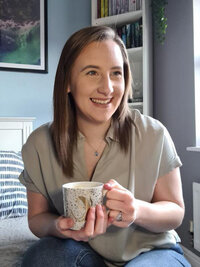 Website conversion consultant client, Ashley Turner sitting at her desk