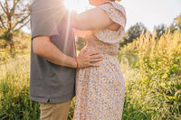 maternity photographer in madison al by whitney briscoe - couple embracing in the sunlight