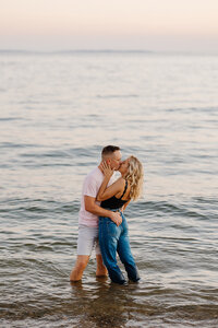 bride & groom kissing on beach