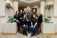 staff at a dentist's office taking a team photo