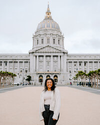 woman in front of city hall building