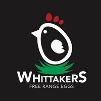 Stylised white chicken icon with red comb and green grass above the text “Whittakers Free Range Eggs” on a black background.