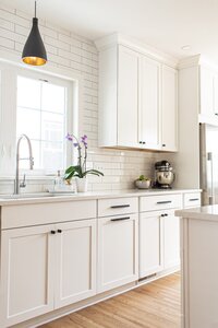Laundry Room Design Inspiration and Remodel with Floral Wallpaper and Wood Counter for Folding Laundry