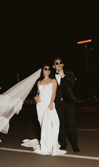 flash photography of bride and groom at night