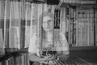 Black and white double exposure image of Allison Bolin Texas wedding photographer and books on a shelf