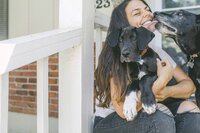 Woman hugging dogs