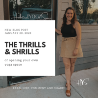 Ariane standing in front of the doors to Habitual Yoga Space