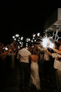 Bride and groom leave via sparkler exit