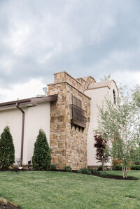 Bride and groom kissing at the Conservatory at Gervasi Vineyard photographed by akron ohio wedding photographer