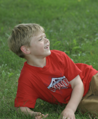 Nate lying in grass