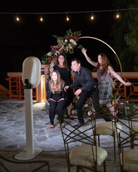 Guests enjoying the photo booth at a Bozeman corporate