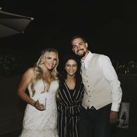 bride &  groom smiling with friend