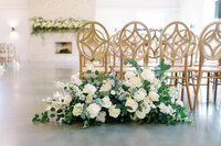ceremony set up with white and green flowers