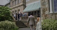 Friends and family dance joyfully during the reception, captured in the wedding video package.