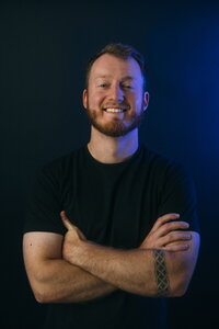 A professional headshot of a team member from Future Fox Media, smiling confidently against a blurred background. This image represents the approachable and skilled team behind Denver’s leading video content creation and marketing agency.