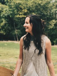 Showit website designer, Unica Formo owner Jordin Brinn looking to the side and smiling.