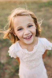 Sweet little girl smiling at the camera