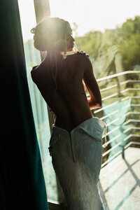 Sensual portrait of a bride getting undressed. Photo by Art of You  Boudoir, based in Austin, TX.