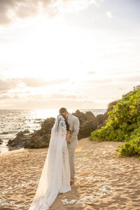 Maui Elopement Photographer captures couple together on beach after wedding