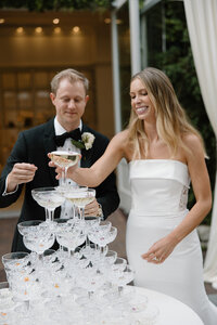 Bride and groom with a champagne tower