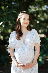 expecting mom holds her bump