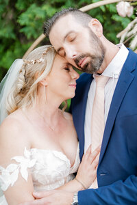 bride and groom snuggle at the minneapolis wedding venue the grand 1858