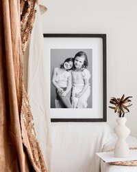 Professional framed portrait on wall.