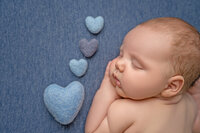 Newborn baby lying on a blanket