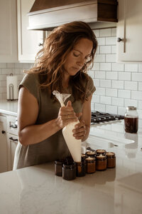 Handcrafting naturally infused grass fed tallow$