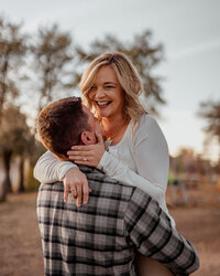 Husband and Wife laughing during photoshoot in Prescott Arizona