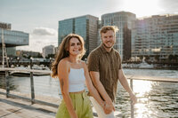 man and woman smiling at camera in seaport Boston