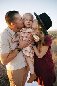 Family enjoying a beach photoshoot in San Diego