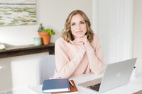 Stephanie sitting in her office