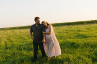 Maternity photos in a green field in Portland Oregon