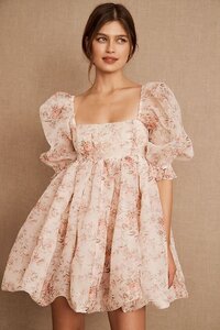 Woman in a short floral puffy dress