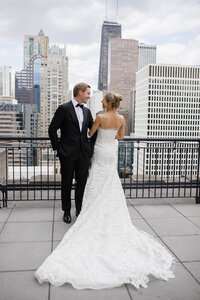 A bride and groom posing for a photo