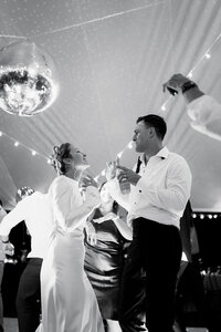 A bride and groom dancing representing having fun at your wedding after hiring Perfect Thirds & Co for Boise wedding or event planning.