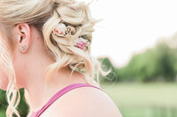 Soft curls updo with small pink roses