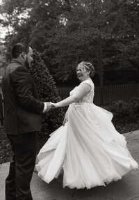 Couple dancing in a courtyard on a fall day.