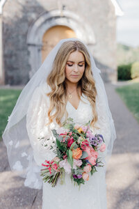 bright-pink-bridal-bouquet-in-brides-hand