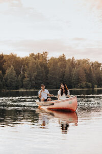 Couple paddling in an canoe