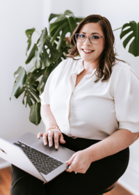 Wedding planner owner working on a laptop, organizing details and managing wedding plans in Columbus, Ohio.