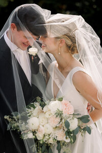 Bride and groom portraits under the veil at Ashton Gardens in Atlanta