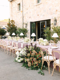monserate winery wedding reception detail of head table with flowers cascading on the table to the ground